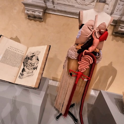 "Corset Anatomia" by Renata Buzzo, right, is displayed during the announcement, at the Metropolitan Museum of Art, in New York, Monday, Nov. 17, 2025, about the next spring fashion exhibit "Costume Art," which is set to launch at the Met Gala in 2026. (AP Photo/Richard Drew)