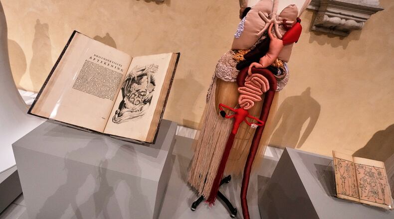 "Corset Anatomia" by Renata Buzzo, right, is displayed during the announcement, at the Metropolitan Museum of Art, in New York, Monday, Nov. 17, 2025, about the next spring fashion exhibit "Costume Art," which is set to launch at the Met Gala in 2026. (AP Photo/Richard Drew)