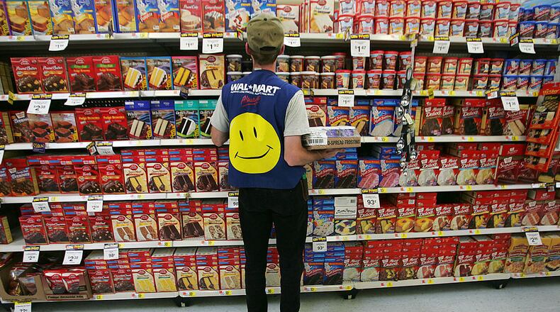 Wal-Mart, America's largest retailer and the largest company in the world based on revenue, has evolved into a giant economic force for the U.S. economy. With growth, the company continues to weather criticism of low wages, anti-union policies as well as accusations that it has homogenized America's retail economy and driven traditional stores and shops out of business.  (Photo by Chris Hondros/Getty Images)