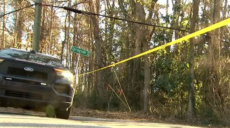 The GBI, at the request of the Atlanta Police Department, is investigating a fatal shooting in which a Fulton County deputy confronted a man in nearby woods after the deputy's home was apparently robbed. (Photo: Channel 2 Action News)