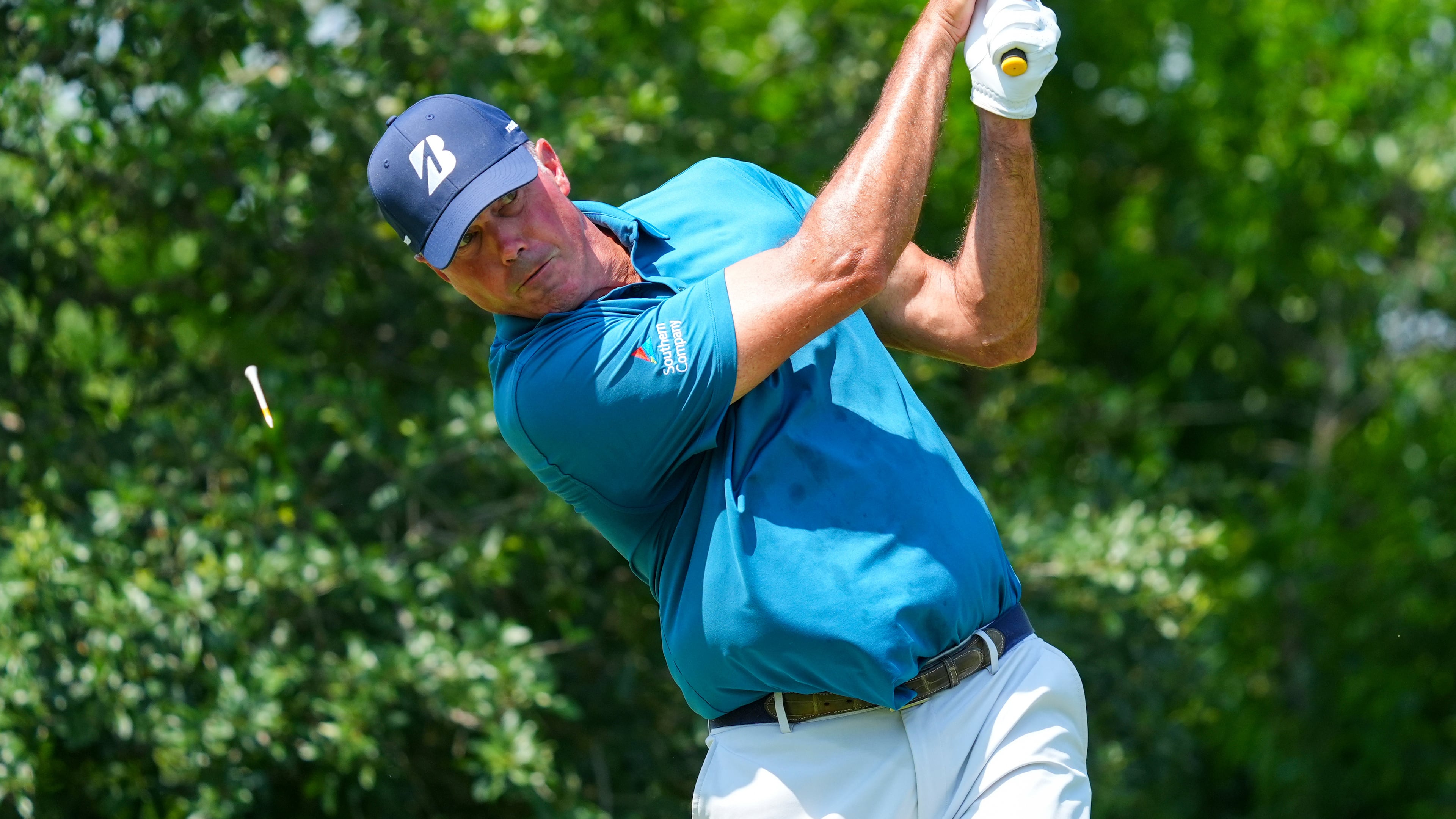 FILE -Matt Kuchar hits off the ninth tee during the first round of the Charles Schwab Challenge golf tournament at Colonial Country Club in Fort Worth, Texas, May 22, 2025. (AP Photo/LM Otero, File)