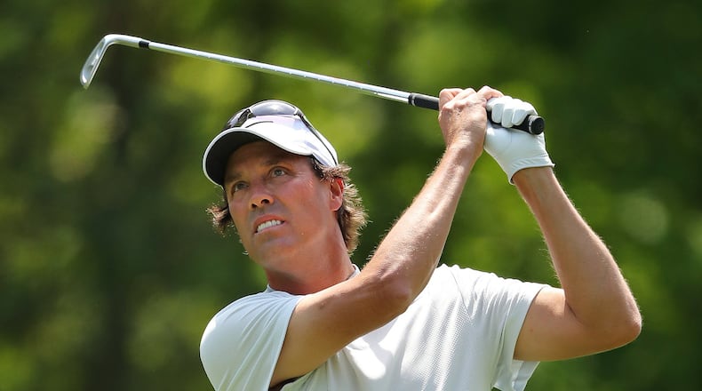 After an uplifting birdie on his first hole, Stephen Ames tees off on No. 2 in Sunday’s final round of the Mitsubishi Electric Classic. (Curtis Compton/ccompton@ajc.com)