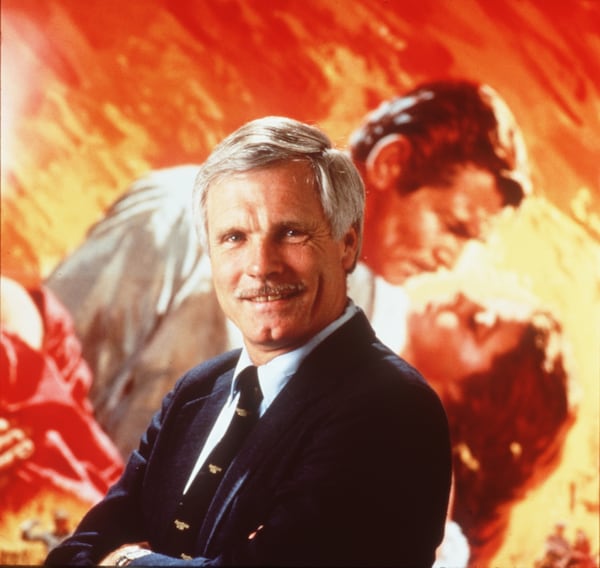 Ted Turner stands in front of a “Gone With the Wind” poster. He styled himself as a modern Rhett Butler, the quipping hero of the movie. (Mark Hill/TBS 1996)
