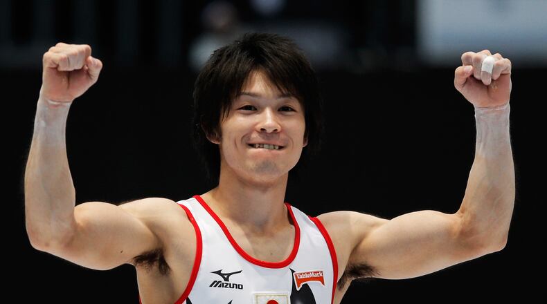 Kohei Uchimura of Japan celebrates after winning the Mens All-Around Final on Day Four of the Artistic Gymnastics World Championships Belgium 2013 held at the Antwerp Sports Palace on October 3, 2013 in Antwerpen, Belgium. (Photo by Dean Mouhtaropoulos/Getty Images)