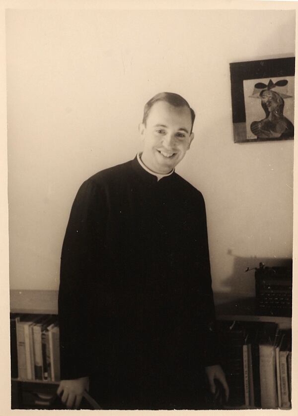 FILE - In this 1966 photo released by the El Salvador School, Argentine seminarian Jorge Mario Bergoglio smiles for a portrait at the El Salvador school where he taught literature and psychology, in Buenos Aires, Argentina. (El Salvador School photo via AP, File)