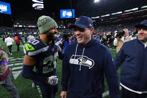 Seahawks safety Julian Love (left) speaks with head coach Mike Macdonald after their divisional playoff game against the 49ers on Saturday, Jan. 17, 2026, in Seattle. (Lindsey Wasson/AP)
