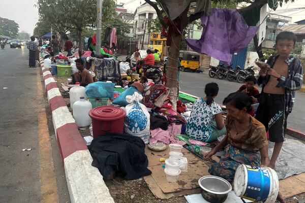 Victims rest on the pavement near Mandalay palace in the aftermath of Friday's earthquake in Mandalay, Myanmar, Wednesday, April 2, 2025. (AP Photo)