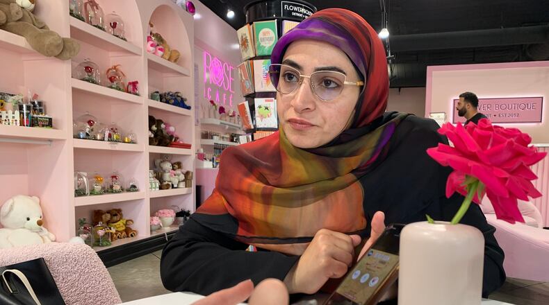 Marwa Mussa discusses plans for a fundraiser while seated at a coffee shop on May 29, 2026, in Dearborn, Mich. (AP Photo/Mike Householder)