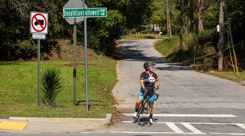 Rolanda Powell waits to merge onto Donald Lee Hollowell Parkway from Center Hill Avenue in Atlanta, Georgia, on Tuesday, October 13, 2020. Rolanda Powell, head of her neighborhood organization, has been raising concerns about the safety of Donald Lee Hollowell Parkway following several recent fatalities. (Photo/Rebecca Wright for the Atlanta Journal-Constitution)
