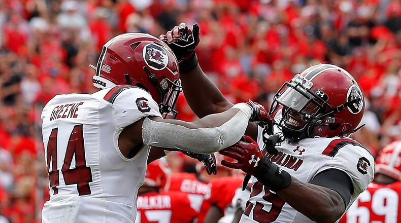 Sherrod Greene (44) and J.T. Ibe (29) of the South Carolina Gamecocks react after a missed field goal by Rodrigo Blankenship (98) of the Georgia Bulldogs in second overtime gave them a 20-17 win at Sanford Stadium on October 12, 2019 in Athens, Georgia. (Kevin C. Cox/Getty Images/TNS)