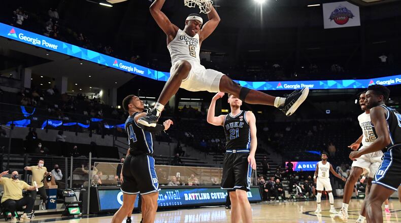 Georgia Tech forward Moses Wright (5) hangs on the basket after dunking the ball in the second half of an NCAA college basketball game at Georgia Tech's McCamish Pavilion in Atlanta on Tuesday, March 2, 2021. Georgia Tech won 81-77 over Duke in overtime. (Hyosub Shin / Hyosub.Shin@ajc.com)