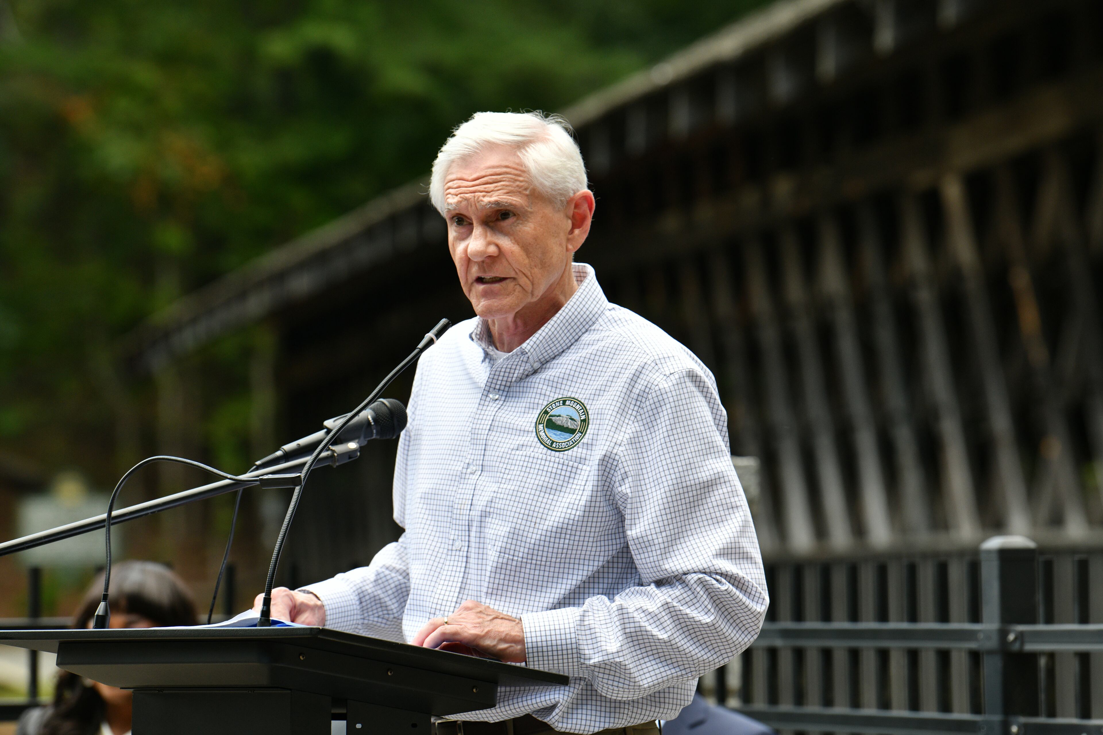 Bill Stephens, CEO of Stone Mountain Memorial Association, welcomes guests on September 16, 2022, during a ceremony to rededicate a historic covered bridge that was created by Washington W. King, a black bridgebuilder who was the son of freed slaves. The covered bridge is one of only four remaining structures of the many created and constructed by Washington W. King. (Hyosub Shin/AJC)