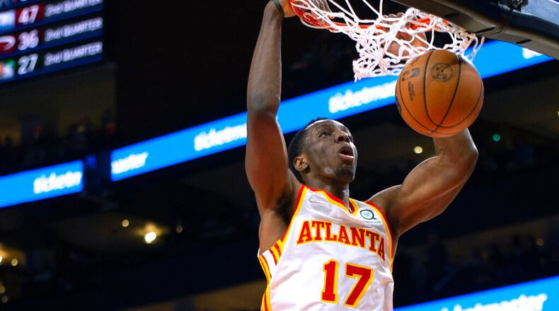 Atlanta Hawks forward Onyeka Okongwu dunks during the first half of the team's NBA basketball game against the Minnesota Timberwolves on Wednesday, Jan. 19, 2022, in Atlanta. (AP Photo/Hakim Wright Sr.)