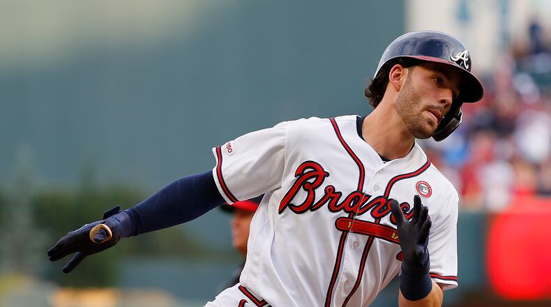 Dansby Swanson leans hard into the first of his two home run trots Thursday night against Philadelphia. (Photo by Kevin C. Cox/Getty Images)