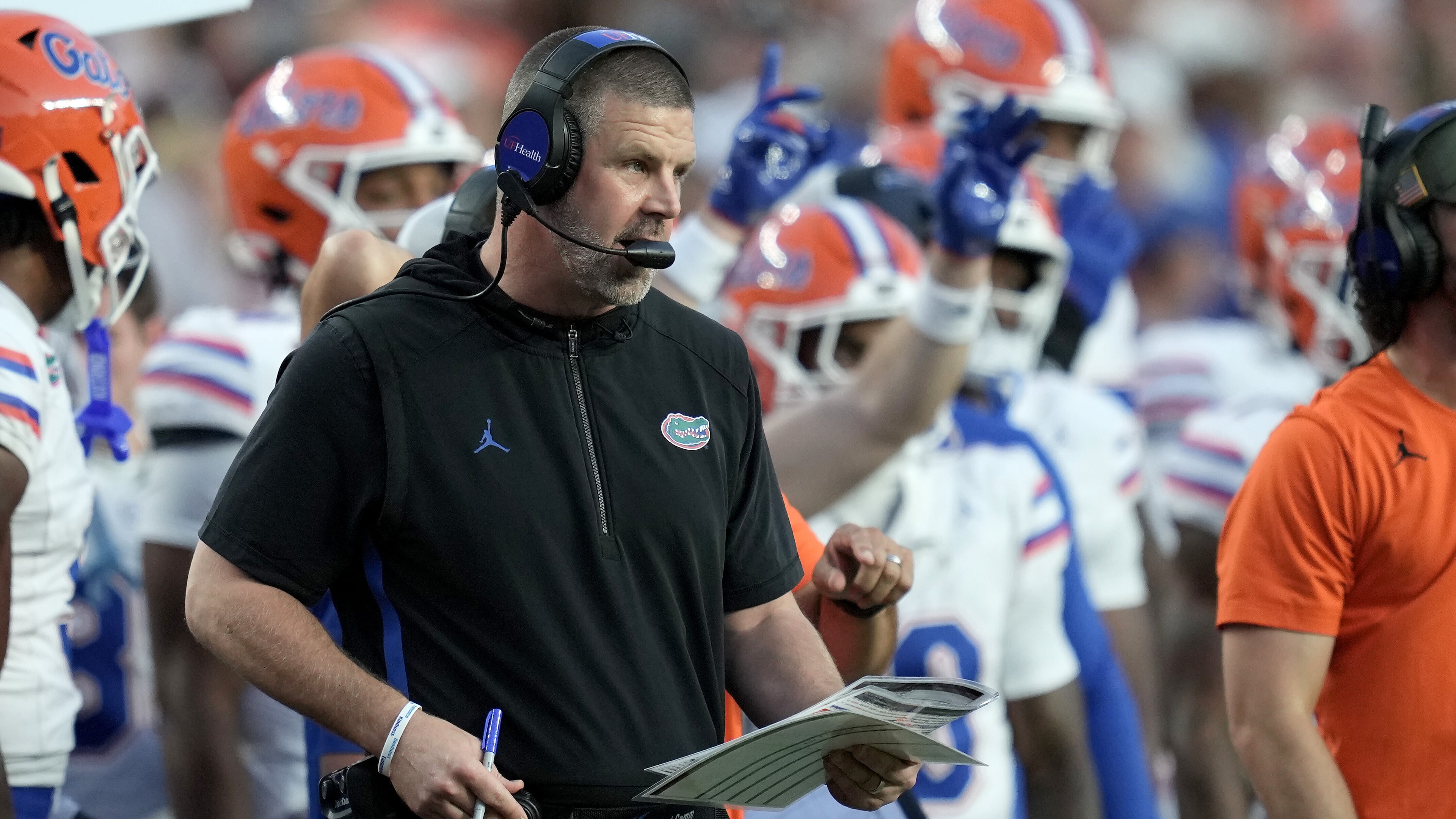 Florida head coach Billy Napier calls in plays to his offense during the first quarter of an NCAA college football game against Texas A&M on Saturday, Oct. 11, 2025, in College Station, Texas. (AP Photo/Sam Craft)