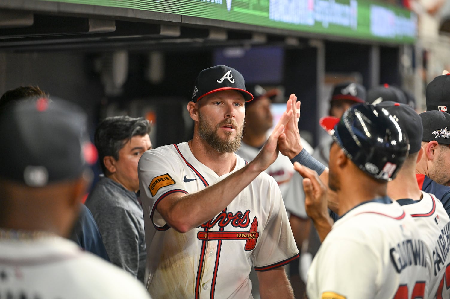 Atlanta Braves pitcher Chris Sale (51) is congratulated by teammates after being relieved late in the ninth inning during a MLB game against the New York Mets Wednesday, June 18, 2025 at Truist Park. (Daniel Varnado/For the Atlanta Journal-Constitution)