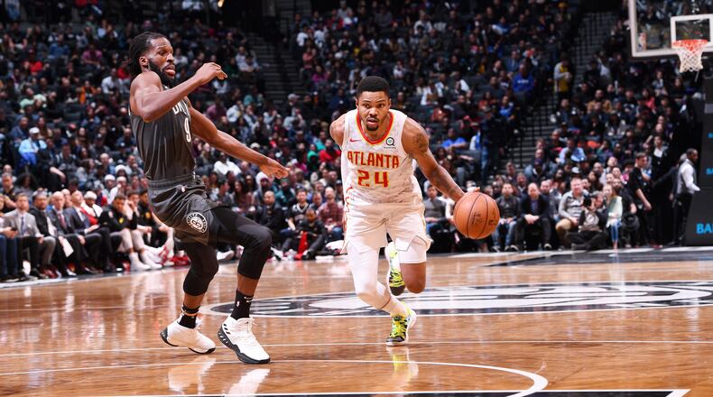 Kent Bazemore  of the Atlanta Hawks drives to the basket against the Brooklyn Nets on December 16, 2018 at Barclays Center in Brooklyn, New York.