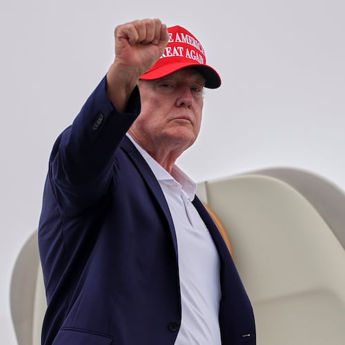 President Donald Trump gestures as he boards Air Force One at Morristown Airport, Sunday, Aug. 16, 2026, in Morristown, N.J. (AP Photo/Julia Demaree Nikhinson)