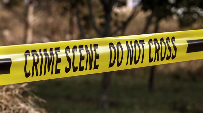 Two people in Arkansas were found stabbed to death and a third person was shot and killed by a police officer whose neck was slashed after he found a man beating one of the stabbing victims with a rock, authorities said.