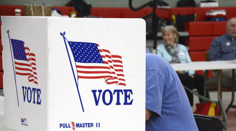 A Fairfield Twp. resident casts his Election Day vote on Tuesday, Nov. 6, 2018, at Fairfield North Elementary School. MICHAEL D. PITMAN/STAFF