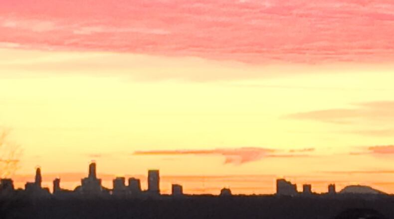 Vicki Netzband submitted this photo she calls “Sunrise over Buckhead Skyline and Stone Mountain.