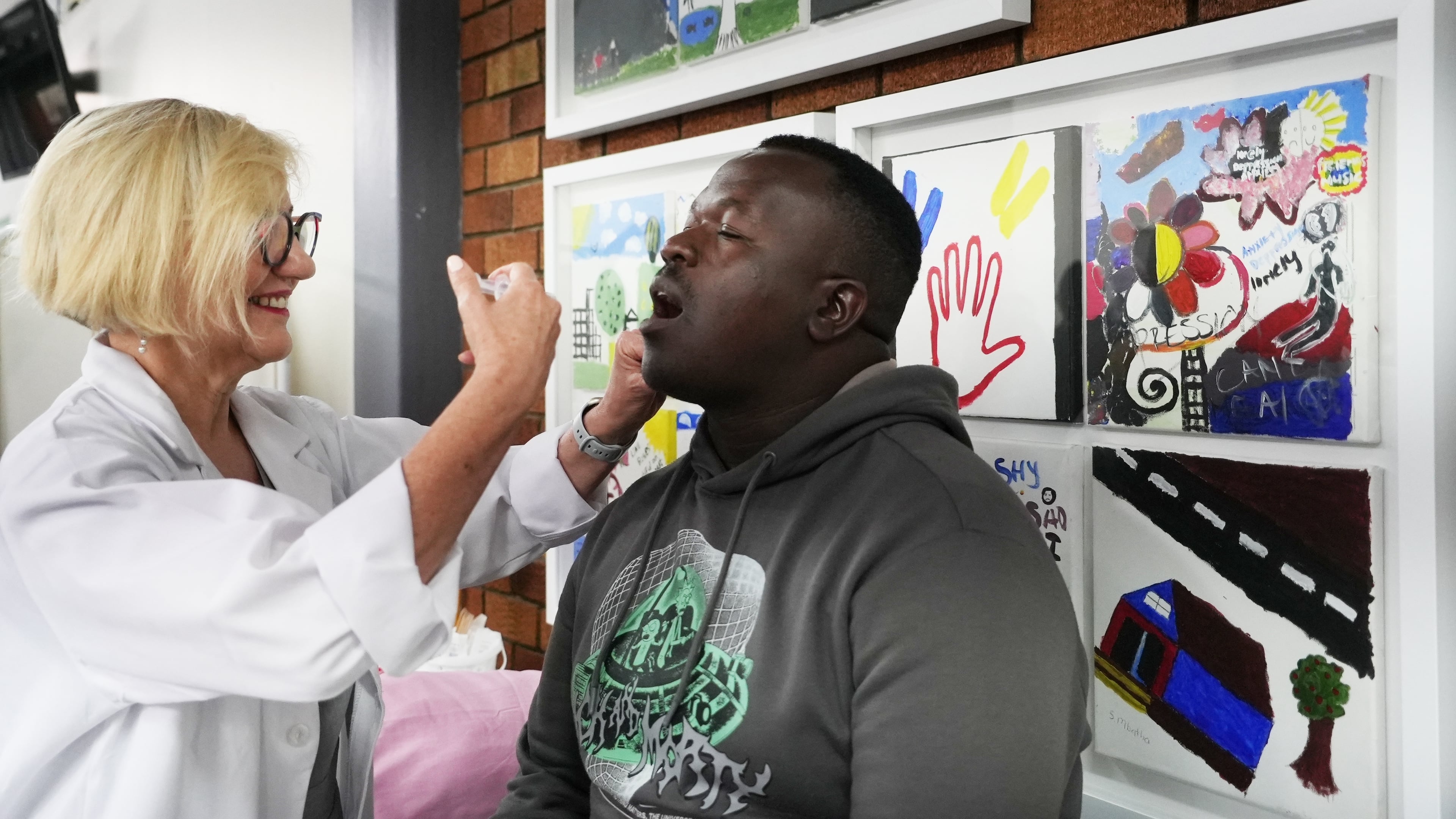 South African Medical Research Council head Prof Glenda Grey administers a cholera vaccine to Shadrack Makutu, a participant in the clinical trials for the vaccine developed by Biovac at the Chris Hani Baragwanath Hospital in Soweto, South Africa, Tuesday, Nov. 11, 2025. (AP Photo/ Alfonso Nqunjana)