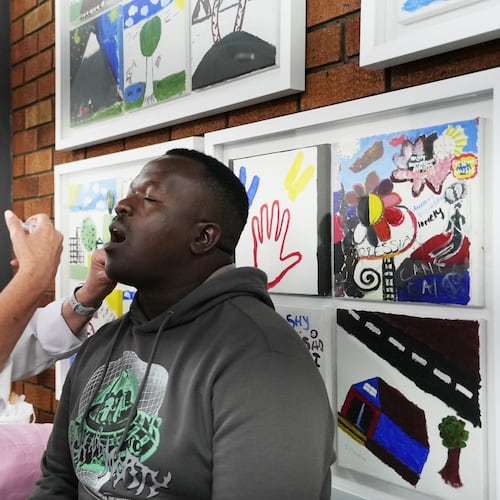 South African Medical Research Council head Prof Glenda Grey administers a cholera vaccine to Shadrack Makutu, a participant in the clinical trials for the vaccine developed by Biovac at the Chris Hani Baragwanath Hospital in Soweto, South Africa, Tuesday, Nov. 11, 2025. (AP Photo/ Alfonso Nqunjana)