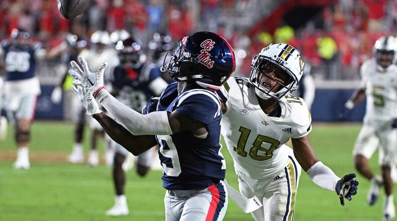 Mississippi wide receiver Dayton Wade (19) catches a pass past Georgia Tech defensive back Ahmari Harvey (18) during the second half an NCAA college football game in Oxford, Miss., Saturday, Sept. 16, 2023. (AP Photo/Thomas Graning)