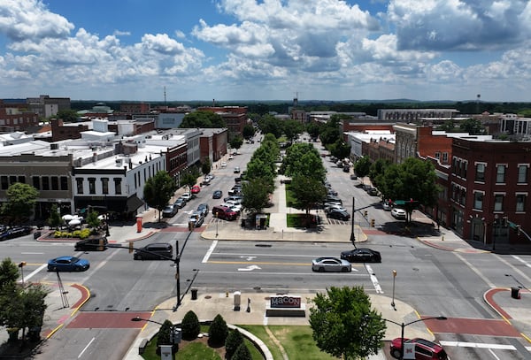 Aerial photo shows Poplar Street in downtown Macon. The downtown core has enjoyed a revitalization, with more restaurants and loft apartments. (Hyosub Shin/AJC)
