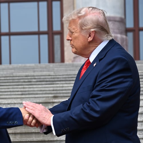 FILE - Chinese President Xi Jinping, left, shakes hands with President Donald Trump at the Great Hall of the People in Beijing, May 14, 2026. (Kenny Holston/Pool Photo via AP, file)