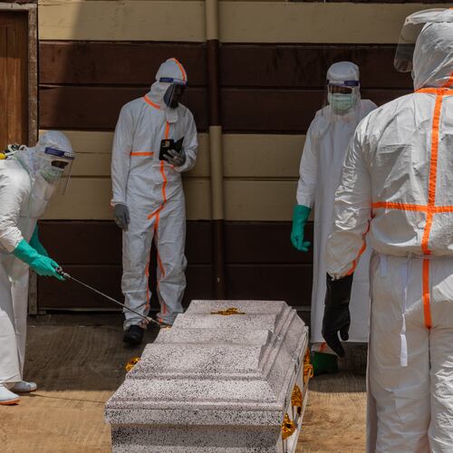 Health workers prepare the coffin of Angèle Muyumba Nsimire, a university student who died of Ebola at the Citadelle Clinic in Bunia, Congo, Friday, June 12, 2026. (AP Photo/Moses Sawasawa)