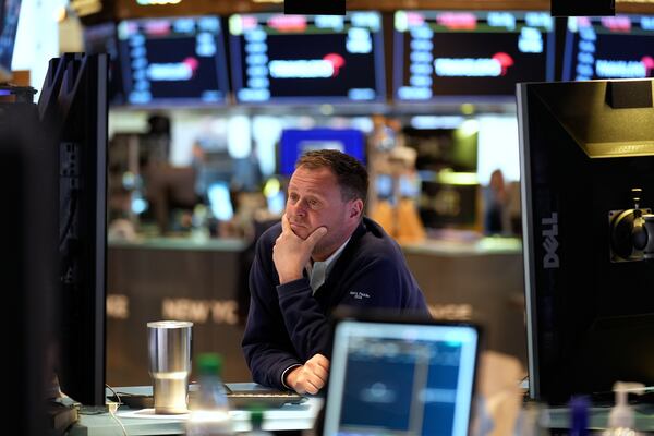 Traders work on the floor at the New York Stock Exchange in New York, Monday, April 7, 2025. (AP Photo/Seth Wenig)