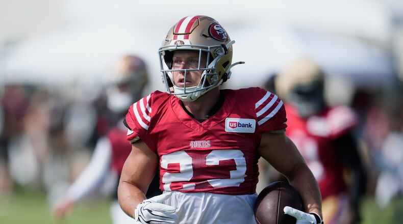 San Francisco 49ers running back Christian McCaffrey (23) runs during the NFL football team's training camp, Thursday, Aug. 6, 2026, in Santa Clara, Calif. (AP Photo/Jeff Chiu)