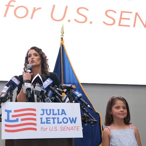 U.S. Senate candidate Rep. Julia Letlow, R-La., speaks to supporters alongside her two children, Jeremiah and Jacqueline, during an election night watch party Saturday, May 16, 2026, in Baton Rouge, La. (AP Photo/Matthew Hinton)