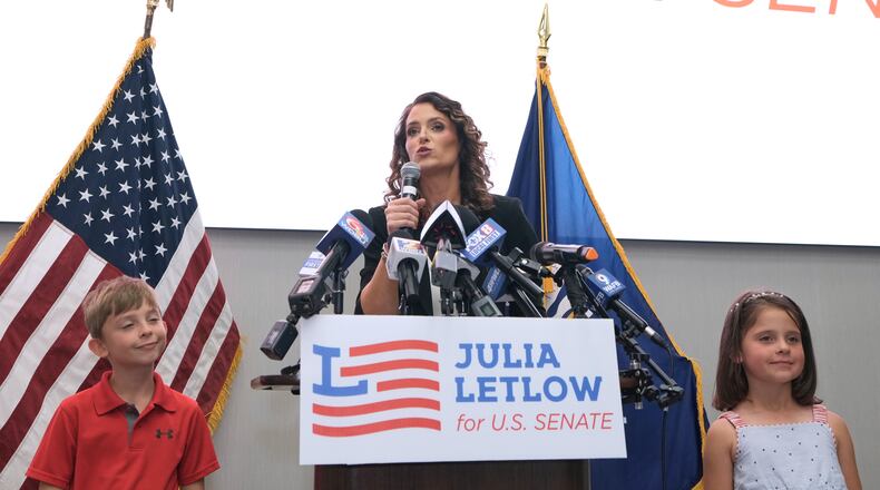 U.S. Senate candidate Rep. Julia Letlow, R-La., speaks to supporters alongside her two children, Jeremiah and Jacqueline, during an election night watch party Saturday, May 16, 2026, in Baton Rouge, La. (AP Photo/Matthew Hinton)