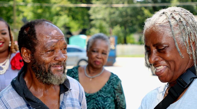 Emanuel Biggs stands with Denia Dixon (r.) and church members at First Iconium Baptist Church. (Photo courtesy of Charlotte Jackson-Johnson)