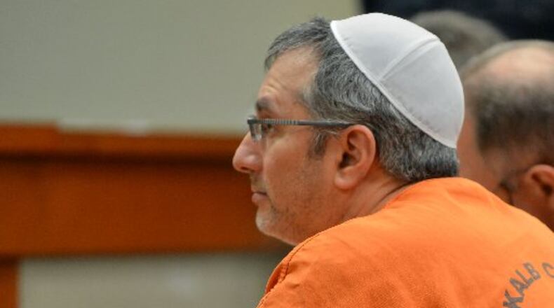 Hemy Neuman, convicted to life in prison for the 2010 murder of Rusty Sneiderman, is seeking a new trial. He is shown during a March 2014 court appearance.
