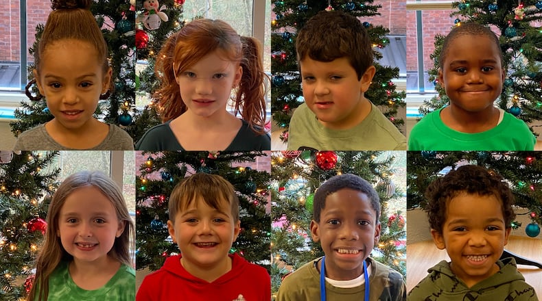 Students at McCall Primary School in Cobb County answer questions about Santa, Mrs. Claus, reindeer and elves in advance of Christmas 2022. Clockwise from top left: Annorah Porter, Ava Nash, Eli Kinney, Jayden Gregory, Xavier Purser, William Davis, Sal Sturino and Raelynn Shrader.