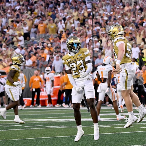 Georgia Tech defensive back Trae Stevenson Jr. (23) celebrates after scoring by Georgia Tech defensive back Elgin Sessions (not picgured) during the first half of an NCAA college football game at Bobby Dodd Stadium on Saturday, Sept. 12, 2026, in Atlanta.(Hyosub Shin/AJC)
