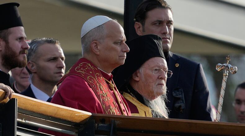 Pope Leo XIV, left, and Ecumenical Patriarch Bartholomew I, the spiritual leader of the world's Eastern Orthodox Christians arrive for an Ecumenical prayer service at archaeological excavations of the ancient Byzantine-era Christian Saint Neophytos Basilica, in Iznik, Turkey, Friday, Nov. 28, 2025, marking the 1,700 years anniversary of the Council of Nicaea. (AP Photo/Khalil Hamra)