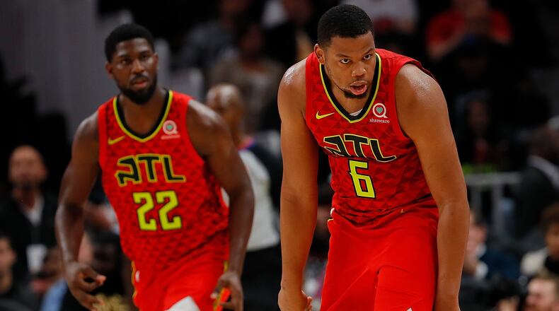 Omari Spellman of the Atlanta Hawks reacts after hitting a 3-point basket against the New York Knicks at State Farm Arena on November 7, 2018 in Atlanta, Georgia.