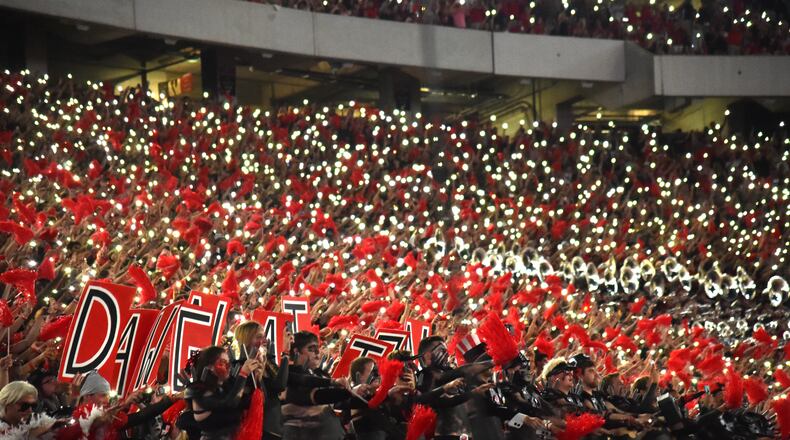 Fans light up the stadium during the second half in a NCAA college football at Sanford Stadium in Athens on Saturday, September 21, 2019. Georgia defeated Notre Dame 23-17. (Hyosub Shin / Hyosub.Shin@ajc.com)