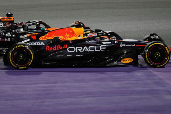 Red Bull driver Max Verstappen of the Netherlands, front, steers his car followed by McLaren driver Oscar Piastri of Australia during the Formula One Saudi Arabian Grand Prix at the Jeddah Corniche Circuit in Jeddah, Saudi Arabia, Sunday, April 20, 2025. (AP Photo/Darko Bandic)