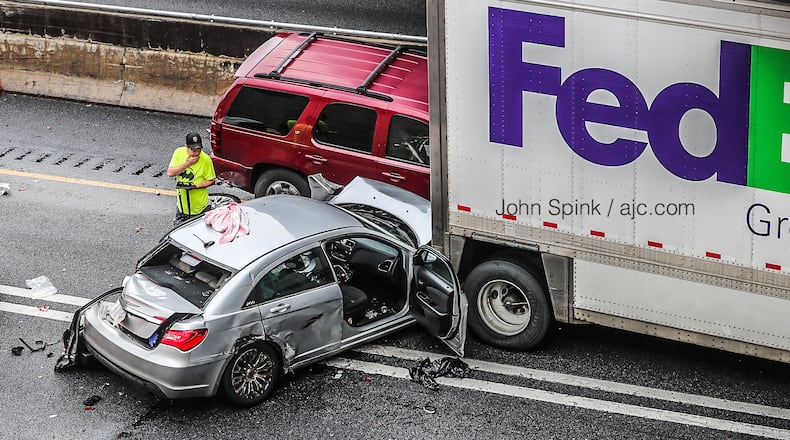 A FedEx box truck and at least two passenger vehicles were involved in one of the wrecks.