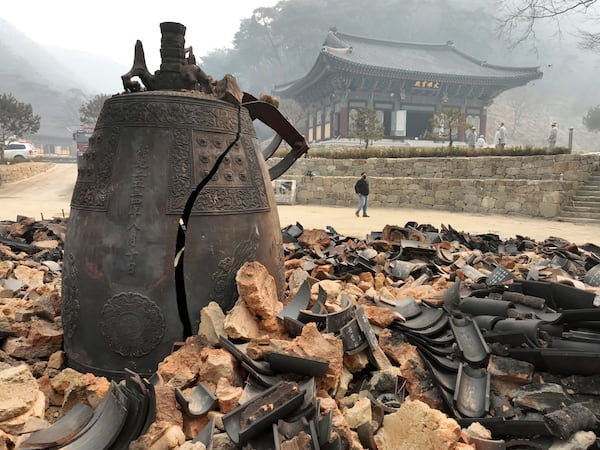 A bell is seen broken at the remains of the bell pavilion at Goun Temple in Uiseong, South Korea, Wednesday, March 26, 2025. (Kim Do-hoon/Yonhap via AP)