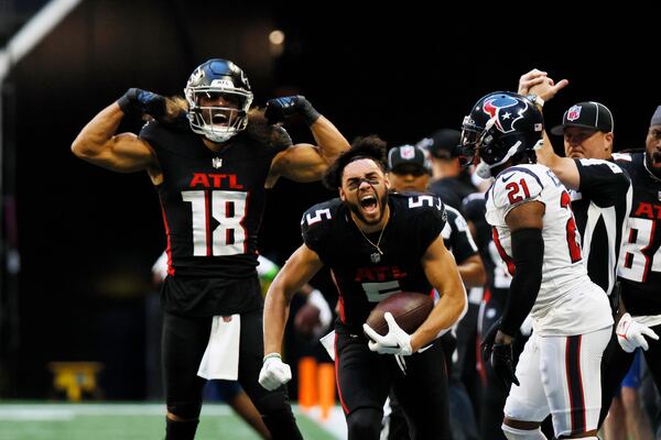 Falcons wide receiver Drake London (5) reacts in the face of Texans cornerback Steven Nelson (21) after a catch during the second half on Sunday, October 8, 2023, at Mercedes-Benz Stadium. 
Miguel Martinez/miguel.martinezjimenez@ajc.com