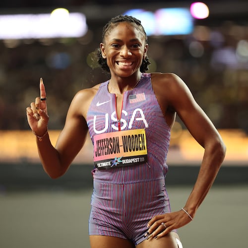Melissa Jefferson-Wooden, of the United States, celebrates after winning the women's 100 meters final and posting a world-leading time during the World Athletics Ultimate Championship in Budapest, Hungary, Saturday, Sept. 12, 2026. (AP Photo/Armin Durgut)
