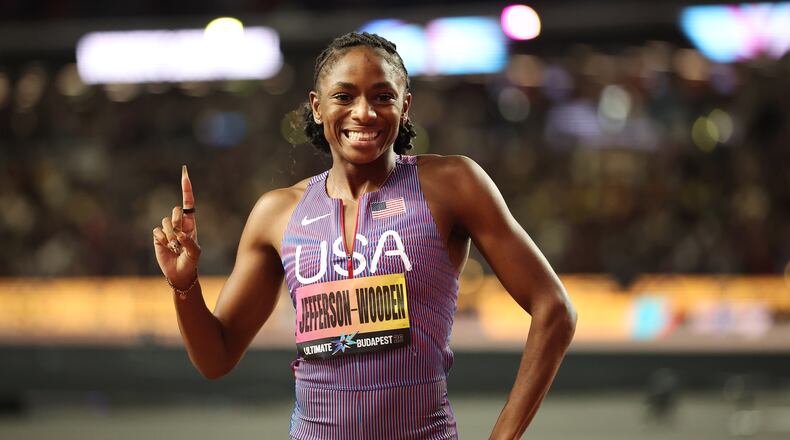 Melissa Jefferson-Wooden, of the United States, celebrates after winning the women's 100 meters final and posting a world-leading time during the World Athletics Ultimate Championship in Budapest, Hungary, Saturday, Sept. 12, 2026. (AP Photo/Armin Durgut)