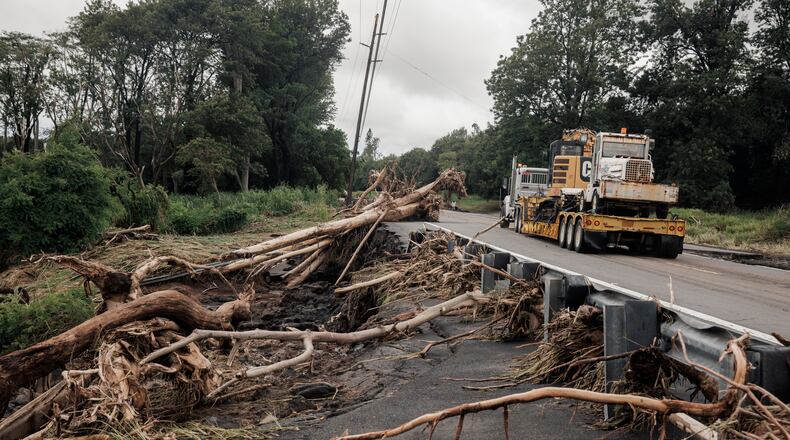 Debris is seen along Hawaiʻi Belt Road near Pahala, Hawaii, Sunday, Aug. 16, 2026, after a severe weather system went through the area. (Stephen Lam/San Francisco Chronicle via AP)