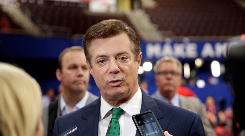 In this July 17, 2016 file photo, Paul Manafort talks to reporters on the floor of the Republican National Convention in Cleveland.